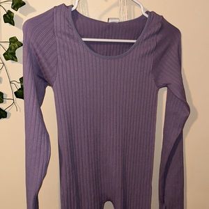 Purple body suit .